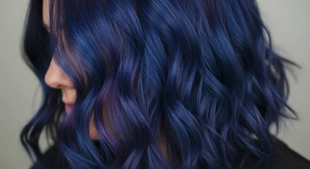 Vibrant, multi-dimensional bold hair color, showcasing a 2026 trend.