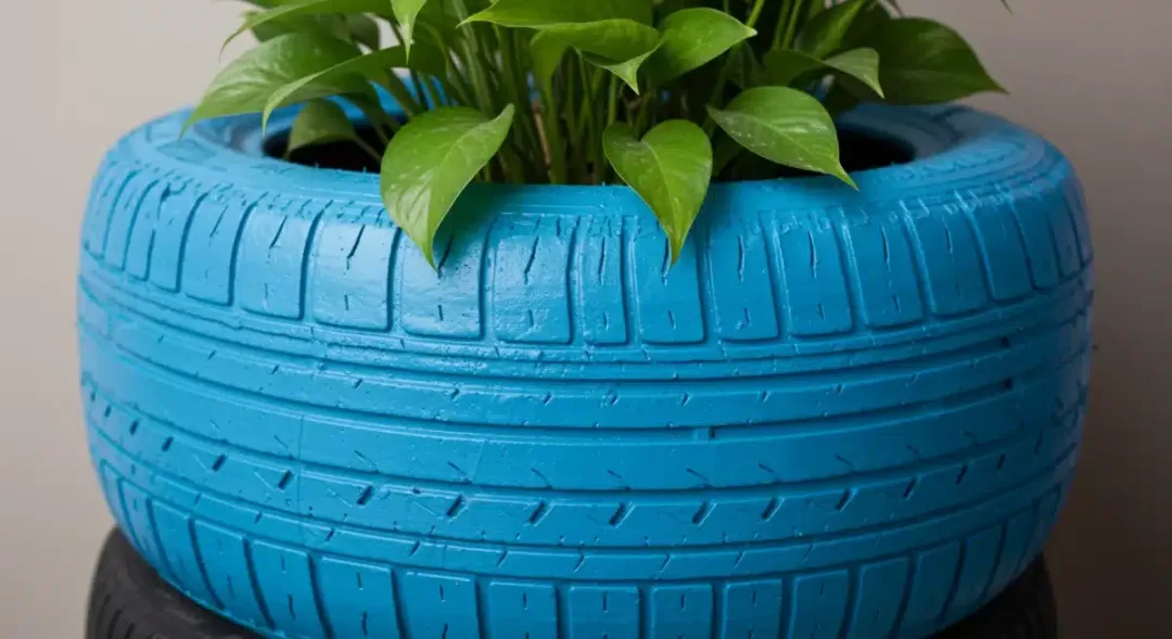 Upcycled tire planter with vibrant plant