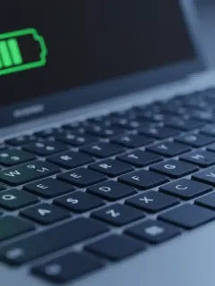 Laptop screen showing a full battery icon, representing extended battery life.